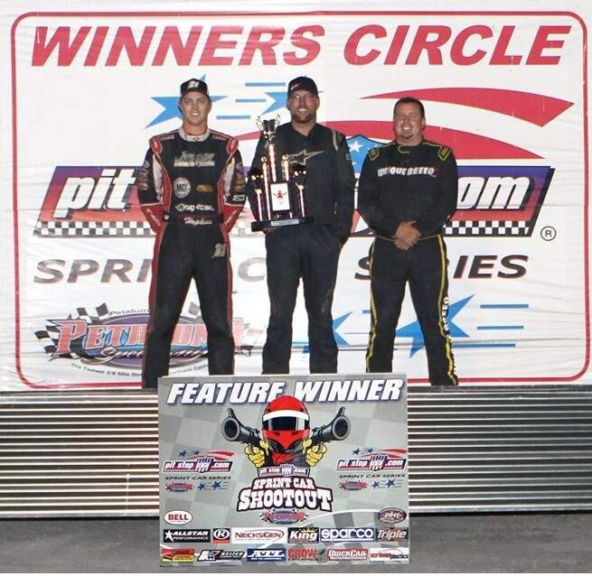 ACTION CAPTURED IMAGES PHOTOBradley Terrell stands atop the podium after his Sprint Car win Left is second-place Shane Hopkins and right is third-place Shawn Arriaga.