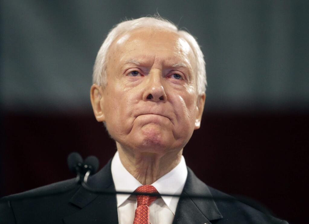 FILE - In this April 23, 2016, file photo, Sen. Orrin Hatch, R-Utah, speaks during the Utah Republican Party 2016 nominating convention in Salt Lake City. Hatch says he will not seek re-election after serving more than 40 years in the U.S. Senate. Hatch, 83, says he's always been a fighter, “but every good fighter knows when to hang up the gloves.” (AP Photo/Rick Bowmer, File)