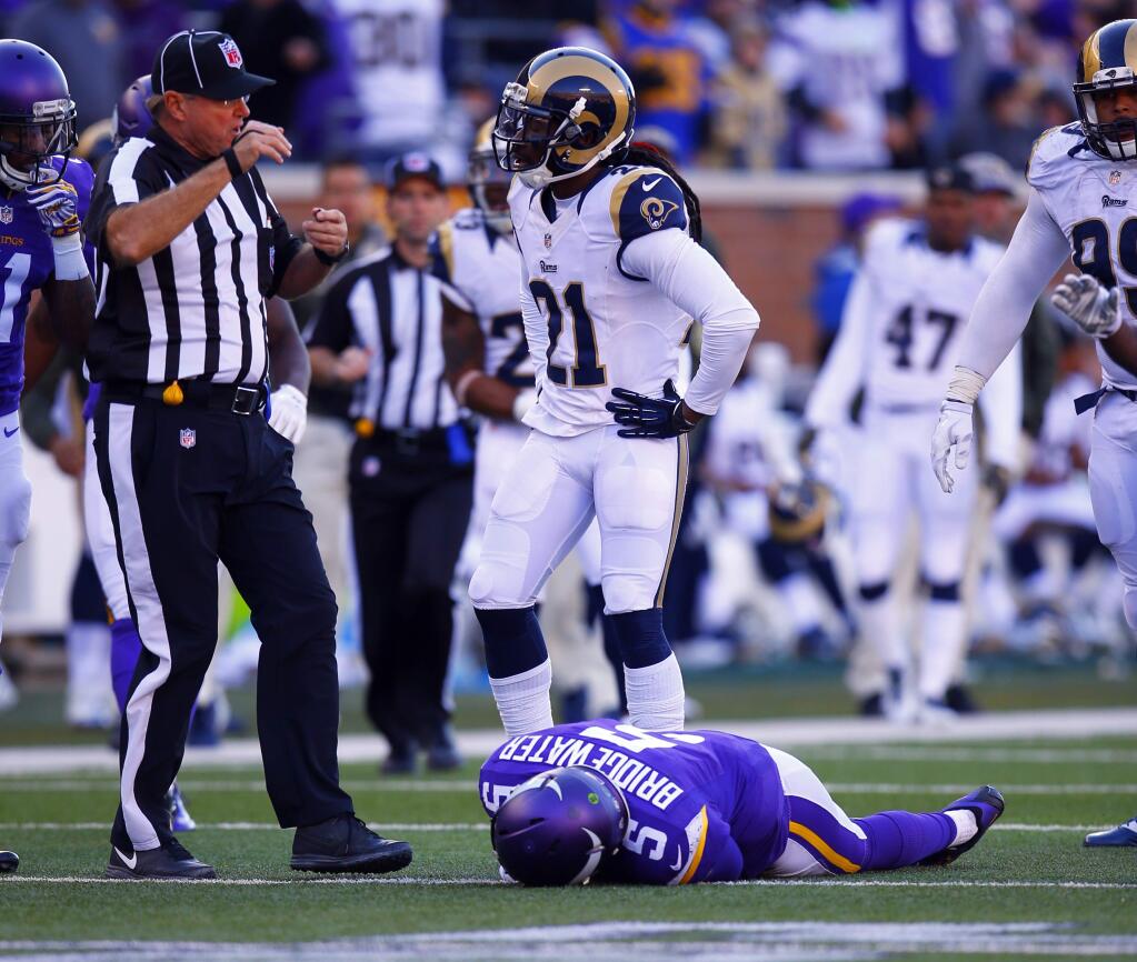Minnesota Vikings quarterback Teddy Bridgewater (5) lies on the field after a tackle to his head by St. Louis Rams cornerback Lamarcus Joyner Sunday, Nov. 8, 2015, in Minneapolis. Bridgewater left the game with a concussion after this hit. The Vikings won in overtime, 21-18. (Jeff Haynes/AP Images for Panini)