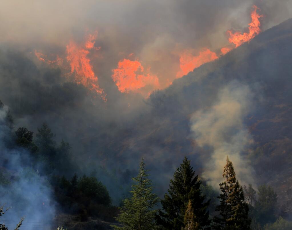 Flames rip up a hillside off Highway 20 in Lake County just east of Blue Lakes on Wednesday, Sept. 3, 2014. (KENT PORTER/ PD)