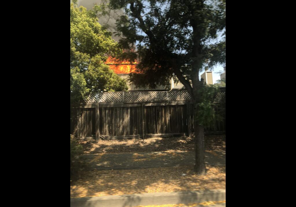 A fire burns a home Saturday in Rohnert Park. (Lisa Beach)