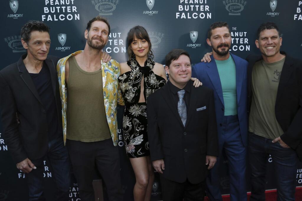 John Hawkes, from left, Tyler Nilson, Dakota Johnson, Zack Gottsagen, Shia LaBeouf and Michael Schwartz attend the LA Special Screening of 'The Peanut Butter Falcon' at The ArcLight Hollywood on Thursday, Aug. 1, 2019, in Los Angeles. (Photo by Willy Sanjuan/Invision/AP)
