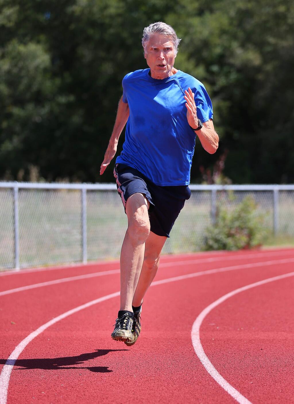 Masters track athlete Larry Barnum, 75, runs the curve at the El Molino High School track in Forestville on Thursday, June 20, 2019. (Christopher Chung / The Press Democrat)
