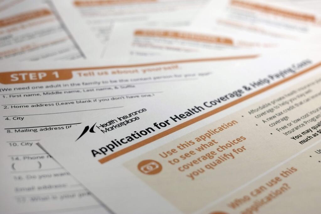 This Sept. 11, 2013, photo shows the federal government form for applying for health coverage. (AP Photo/J. David Ake)