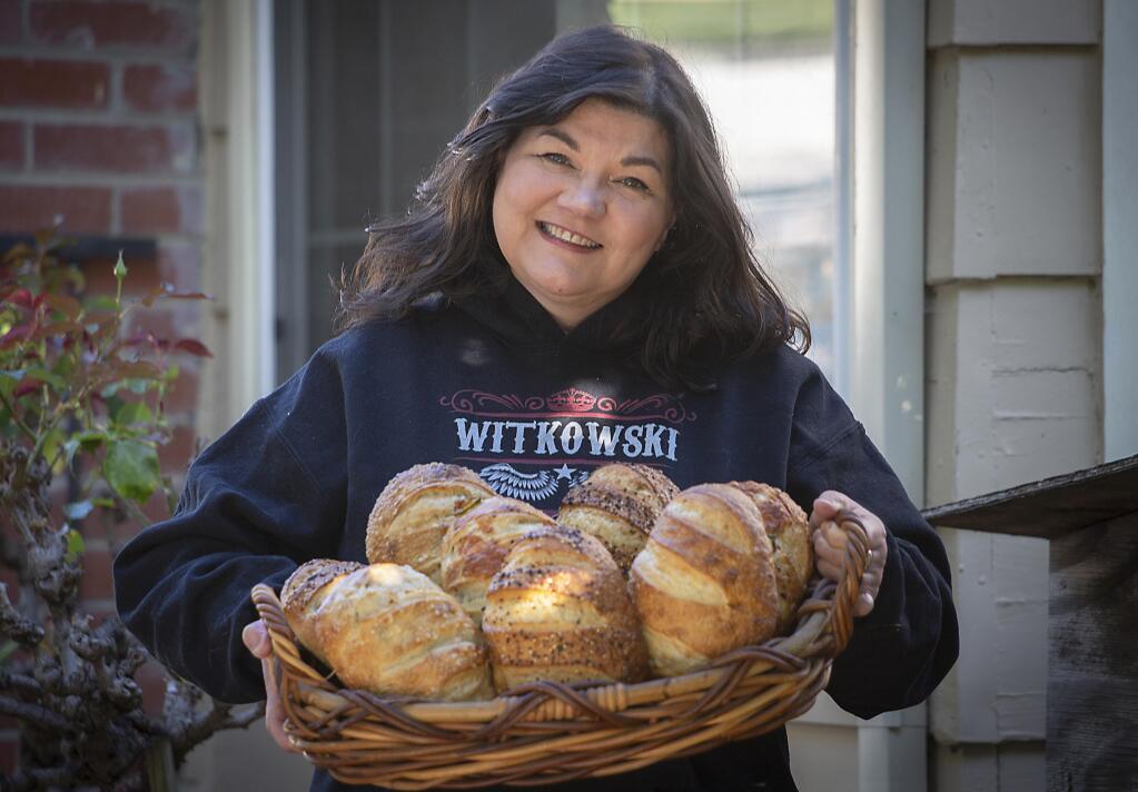 Best thing since sliced bread: Michelle Finn with a selection of her home-baked sourdough on Monday, Aug. 3. (Photo by Robbi Pengelly/Index-Tribune)