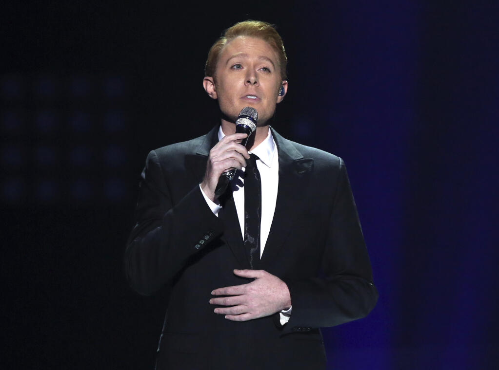 FILE - Clay Aiken performs at the "American Idol" farewell season finale in Los Angeles on April 7, 2016. The former “American Idol” runner-up announced on Monday that he's running for Congress again in North Carolina, this time seeking to succeed the retiring U.S. Rep. David Price. In 2014, Aiken won the Democratic nomination for a largely rural central congressional district in 2014, edging former state Commerce Secretary Keith Crisco. But he lost in the general election to then-Republican incumbent Renee Ellmers, receiving 41% of the vote.(Photo by Matt Sayles/Invision/AP, File)