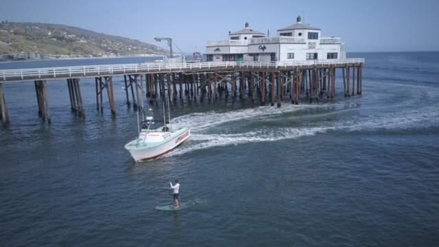 A paddle boarder was arrested on Thursday, April 2, 2020, after he refused to get out of the ocean near the Malibu Pier. Beaches across the state have been closed amid the coronavirus pandemic. (Lost Hills Sheriff's Station/Facebook)