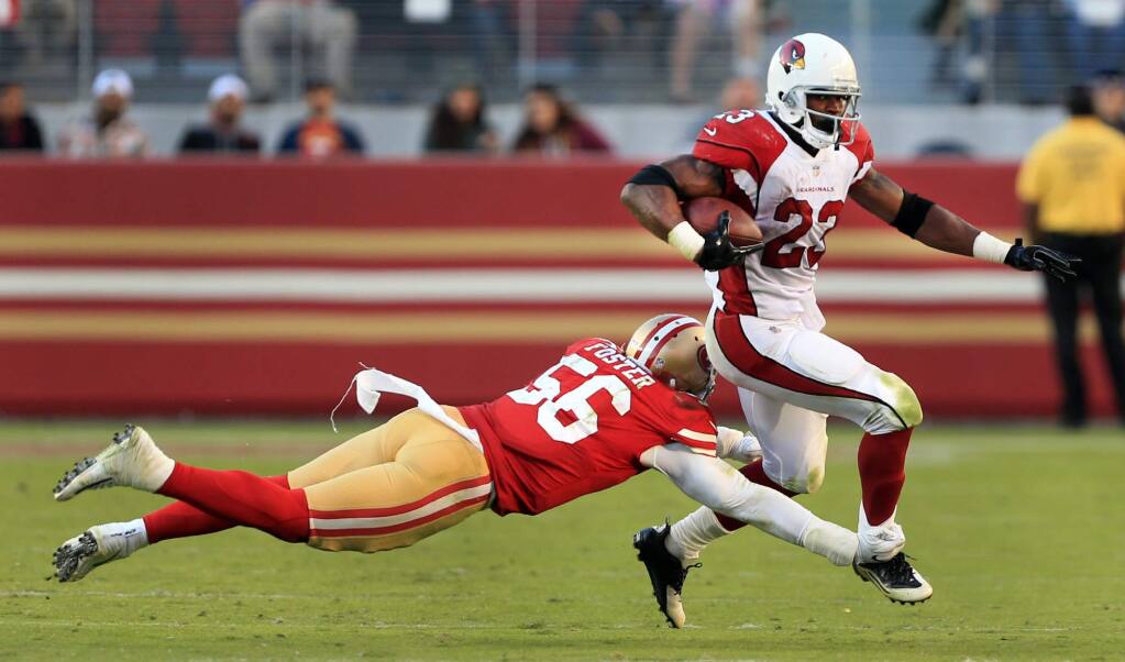 Reuben Foster makes a shoestring tackle on Adrian Peterson during the 49ers' 20-10 loss to Arizona, Sunday Nov. 5, 2017 in Santa Clara. (Kent Porter / The Press Democrat)