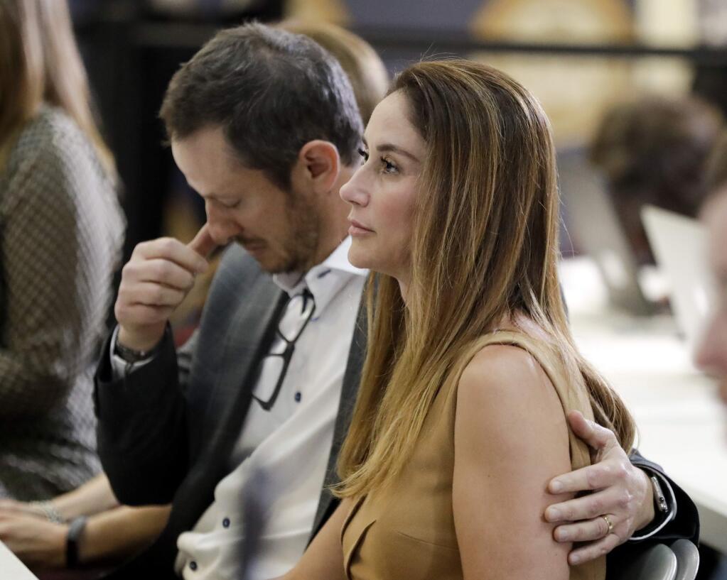 Jeanne Bernstein, right, and her husband Gideon parents of murder victim Blaze Bernstein, listen during a news conference Thursday, Aug. 2, 2018, in Santa Ana, Calif. Orange County District Attorney Tony Rackauckas, said Thursday they will file a hate crime sentencing enhancement against 21-year-old Samuel Woodward in the murder of 19-year-old sophomore Blaze Bernstein. (AP Photo/Chris Carlson)