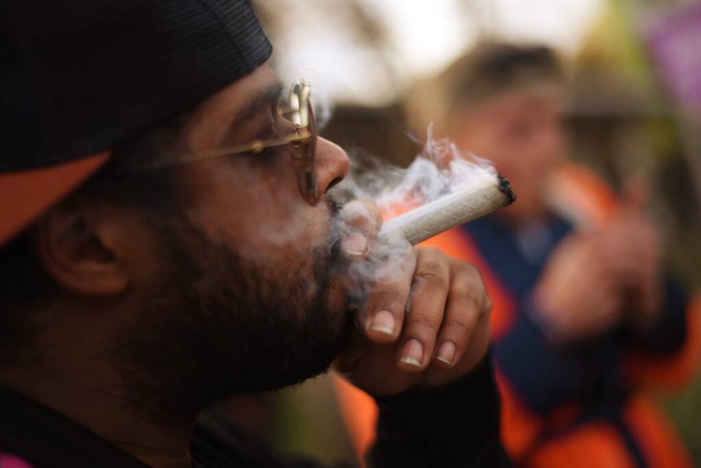 Tony Cocho, of Mendocino enjoying a joint during Emerald Cup held at Sonoma County Fairgrounds in Santa Rosa, Calif. on Saturday, Dec. 14, 2019.(Photo: Erik Castro/for The Press Democrat)
