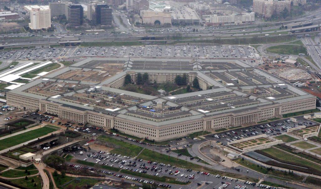 FILE - In this March 27, 2008 file photo, the Pentagon is seen in this aerial view in Washington. President Donald Trump says he will bar transgender individuals from serving “in any capacity” in the armed forces. Trump said on Twitter Wednesday, July 26, 2017, that after consulting with “Generals and military experts,” that “the U.S. Government will not accept or allow Transgender individuals to serve in any capacity in the U.S. Military.” (AP Photo/Charles Dharapak, File)