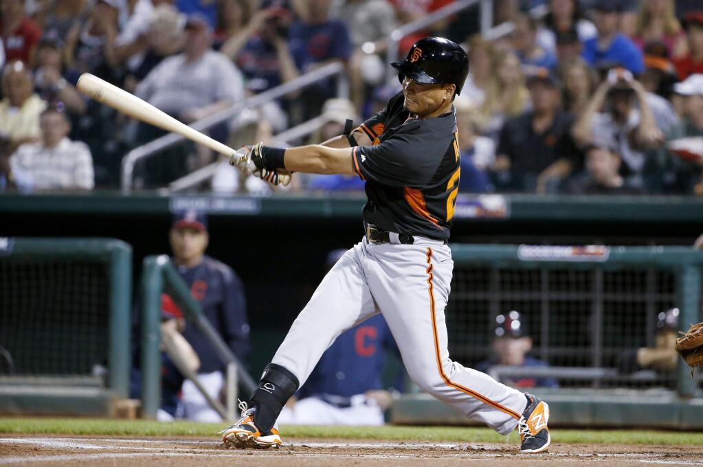 San Francisco Giants' Norichika Aoki, of Japan, connects for a single against the Cleveland Indians during the first inning of a spring training baseball game Tuesday, March 24, 2015, in Goodyear, Ariz. (AP Photo/Ross D. Franklin)