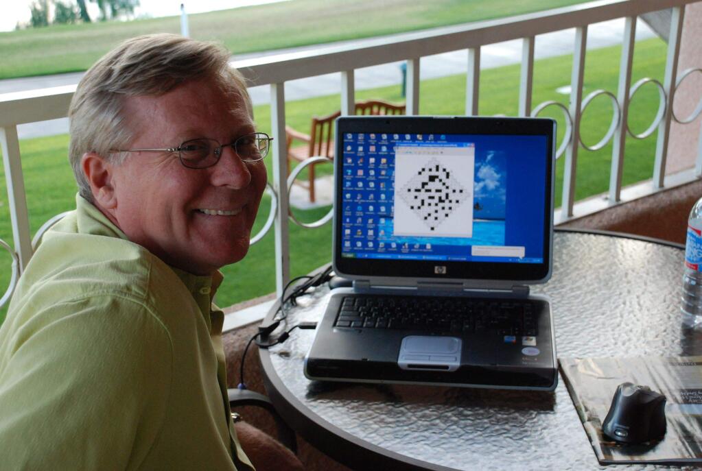 Myles Mellor, known as the 'Puzzle King,' works on a word puzzle for his large roster of clients.