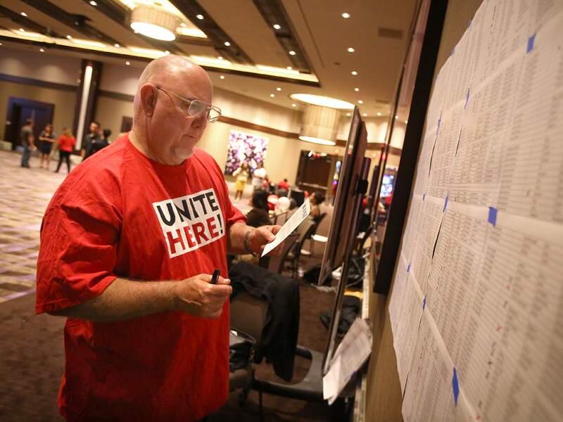 Union organizing committee member Rickey Baker marks off the names of employees who have filled out a union card at the Graton Resort & Casino in Rohnert Park on Tuesday, June 17, 2014. (CHRISTOPHER CHUNG/ PD FILE)