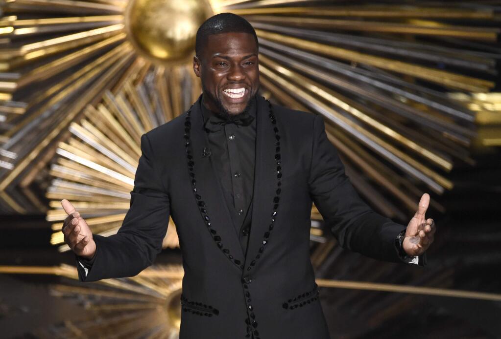FILE- In this Feb. 28, 2016, file photo, Kevin Hart speaks at the Oscars at the Dolby Theatre in Los Angeles. (Photo by Chris Pizzello/Invision/AP, File)