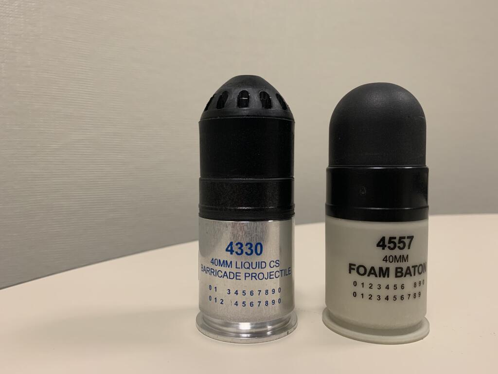 This photograph from an Santa Rosa Police Department investigation shows the similarity between two rounds fired from a 40mm launcher. On the left is a round designed to penetrate physical barricades, on the right, a “rubber bullet.” Both are damaging to people but only one was authorized for use on protesters. (SRPD)