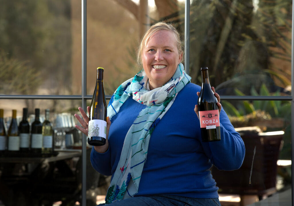 Terra Jane Albee, founder of Ownroot Collective, holds wines made by “entrepreneurial winemakers” at Hudson Napa Valley's winery and vineyard, Friday, Oct. 28, 2022, in Napa. (Darryl Bush / For The Press Democrat)