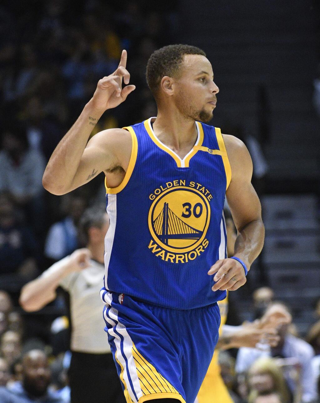 Golden State Warriors guard Stephen Curry gestures after hitting a 3-pointer during the second half of an NBA preseason basketball game against the Los Angeles Lakers Wednesday, Oct. 19, 2016, in San Diego. (AP Photo/Denis Poroy)