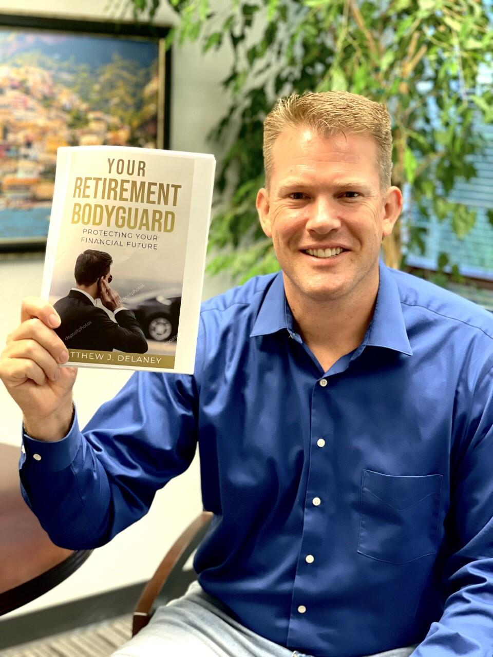 JDH Wealth adviser Matt Delaney, seen here with his book he wrote on retirement, calls the last two-year period the ‘tale of two pandemics.’ Photo courtesy of JDH Wealth