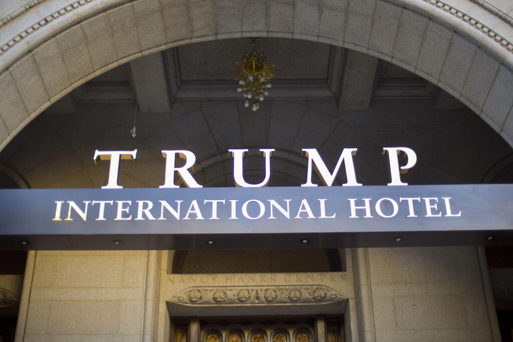 FILE - This Monday, Sept. 12, 2016, file photo, shows the exterior of the Trump International Hotel in downtown Washington. Republican presidential candidate Donald Trump has suggested that his presidential campaign will boost his hotel business and personal brand. But after a tumultuous run up to the election, including lewd statements about women and derogatory remarks about immigrants, there's some evidence that Trump's brand is being tarnished. (AP Photo/Pablo Martinez Monsivais, File)