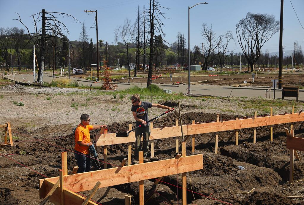 Nick Dunn, left, and Robert Grant prepare for the foundation to be poured on a home on Jean Marie Drive in the Mark West Estates neighborhood on Monday, April 23, 2018. (CHRISTOPHER CHUNG/ PD)