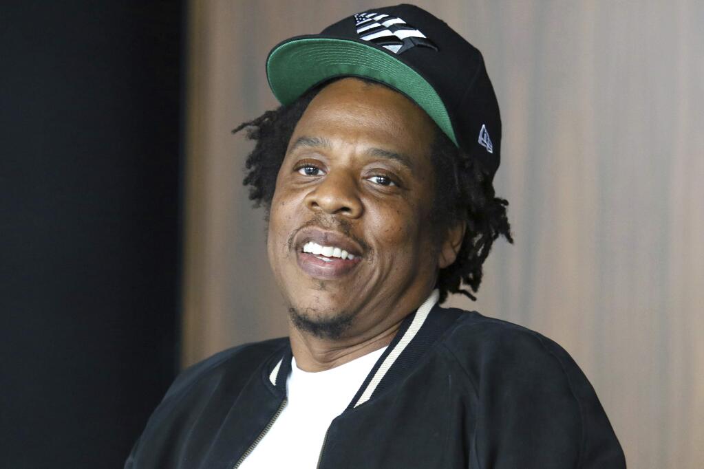 FILE - In this July 23, 2019, file photo, Jay-Z makes an announcement of the launch of Dream Chasers record label in joint venture with Roc Nation, at the Roc Nation headquarters in New York. The NFL and Jay-Z's entertainment and sports representation company are teaming up for events and social activism.The league not only will use Jay-Z's Roc Nation to consult on its entertainment presentations, including the Super Bowl halftime show, but will work with the rapper and entrepreneur's company to “strengthen community through music and the NFL's Inspire Change initiative.” (Photo by Greg Allen/Invision/AP, File)