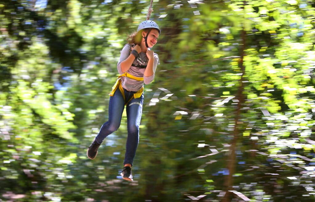 Christopher Chung/The Press Democrat file photoZoe Ingram, an intern with the Academy of Sciences' Careers in Science program, rides a zip line in 2014 at the ropes course on Sonoma Mountain.
