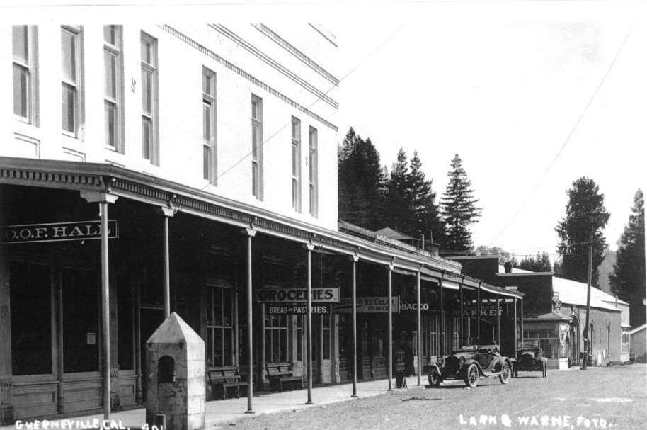 Guerneville, looking east down Main Street, showing the I.O.O.F. Hall, grocery store, Warne and Lark Drug Store, Buchanan's Ice Cream Parlor, Hetzel's Tobacco Store, Drake Brothers Meat Market, and Tunstall Livery Stable. (Courtesy of the Sonoma Heritage Collection -- Sonoma County Library, circa 1919)