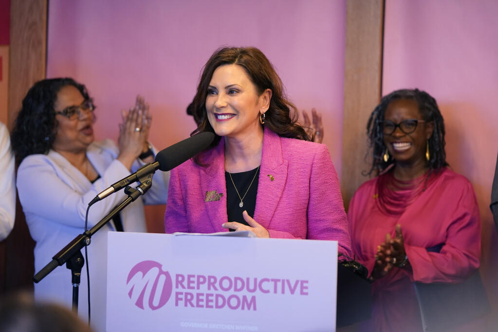 Michigan Gov. Gretchen Whitmer addresses supporters before signing legislation to repeal the 1931 abortion ban statute, which criminalized abortion in nearly all cases during a bill signing ceremony, Wednesday, April 5, 2023, in Birmingham, Mich. The abortion ban, which fueled one of the largest ballot drives in state history, had been unenforceable after voters enshrined abortion rights in the state constitution last November. (AP Photo/Carlos Osorio)