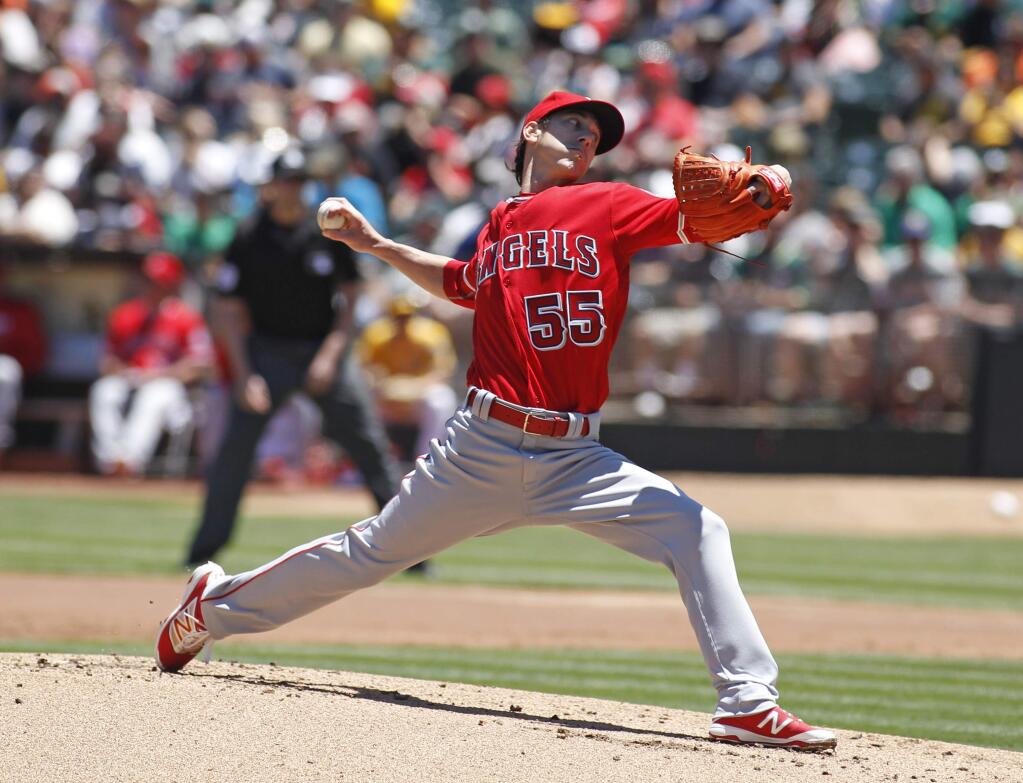 Los Angeles Angels pitcher Tim Lincecum throws to the Oakland Athletics during the first inning Saturday, June 18, 2016, in Oakland. (AP Photo/George Nikitin)