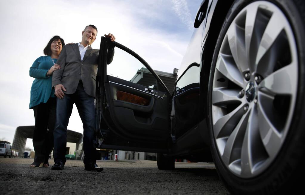 Gary and Jennifer Buffo are the owners of Pure Luxury Transportation in Petaluma, California on Wednesday, February 11, 2015. (BETH SCHLANKER/ The Press Democrat)