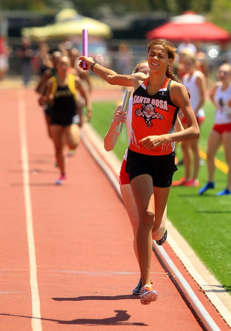 Santa Rosa High's Kirsten Carter completes an amazing comeback to win the girls 4X400m race at the NCS Redwood Empire track meet at Santa Rosa High School on Saturday. (JOHN BURGESS / The Press Democrat)