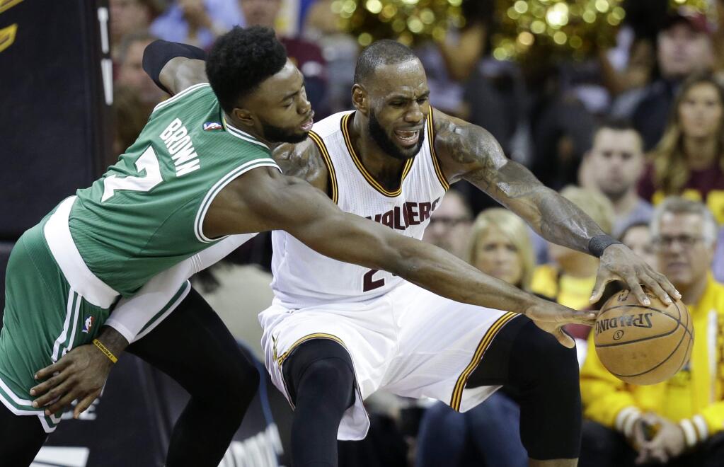 Boston Celtics' Jaylen Brown (7) defends against Cleveland Cavaliers' LeBron James (23) during the first half of Game 3 of the NBA basketball Eastern Conference finals, Sunday, May 21, 2017, in Cleveland. (AP Photo/Tony Dejak)