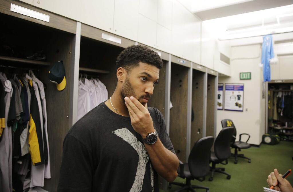 Oakland Athletics shortstop Marcus Semien answers questions in the clubhouse during an end-of-season media availability Monday, Oct. 5, 2015, in Oakland, Calif. (AP Photo/Eric Risberg)