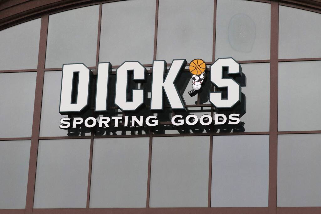 A sign for Dick's Sporting Goods store is displayed at the store Thursday, March 1, 2018, in Madison, Miss.  (AP Photo/Rogelio V. Solis)