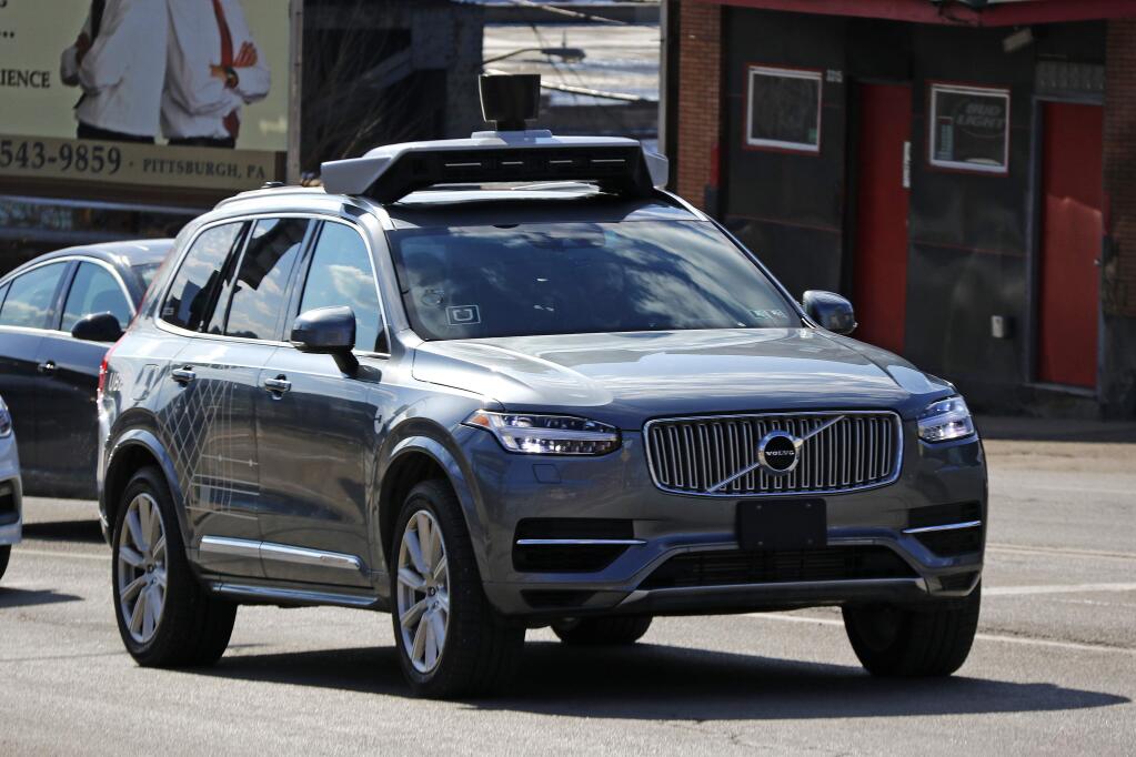 This March 17, 2017, photo shows an Uber self-driving Volvo in Pittsburgh. The Pennsylvania Department of Transportation has approved Uber's request to resume testing of autonomous vehicles on public roads in the Pittsburgh area. The approval, effective Monday, Dec. 17, 2018, and lasting for one year, comes about nine months after one of Uber's autonomous test vehicles hit and killed an Arizona pedestrian. Testing was suspended after March 18 crash in Tempe, Arizona. (AP Photo/Gene J. Puskar)