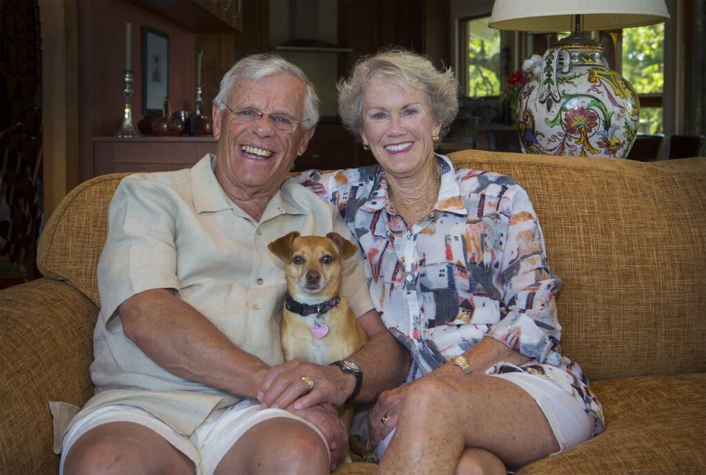 Shown here at home with their dog Rosy - a Pet's Lifeline rescue - Steve and Holly Kyle bask in the celebrity of being named the Sonoma Community Center's Muse for 2018. (Photo by Robbi Pengelly/Index-Tribune)