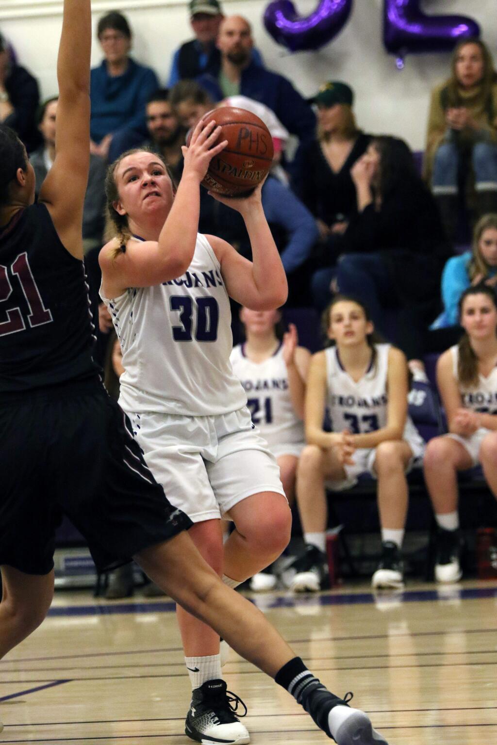 DWIGHT SUGIOKA/ FOR THE ARGUS-COURIERPetaluma senior Emily O'Keefe takes the ball to hoop against Healdsburg in her final home game for the T-Girls.