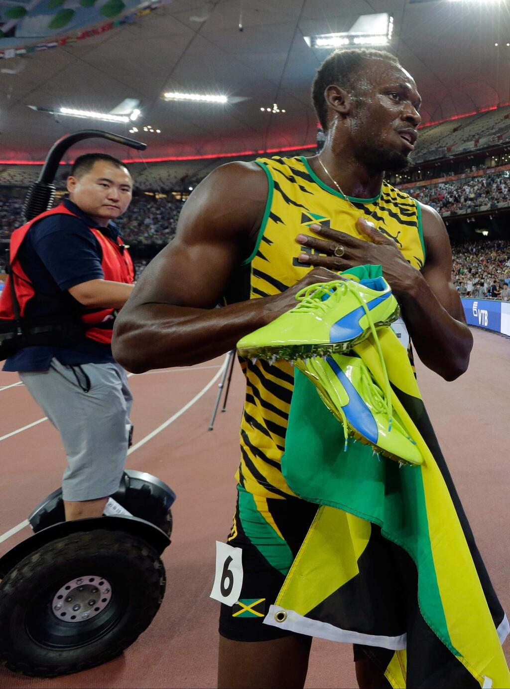 Jamaica's Usain Bolt celebrates after winning the gold in the men's 200m final at the World Athletics Championships at the Bird's Nest stadium in Beijing, Thursday, Aug. 27, 2015. (AP Photo/Andy Wong)
