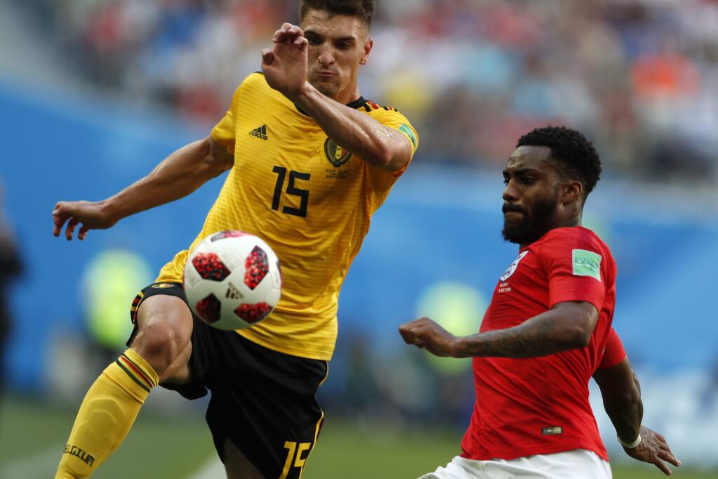 Belgium's Thomas Meunier, left, and England's Danny Rose challenge for the ball during the third place match between England and Belgium at the 2018 soccer World Cup in the St. Petersburg Stadium in St. Petersburg, Russia, Saturday, July 14, 2018. (AP Photo/Natacha Pisarenko)