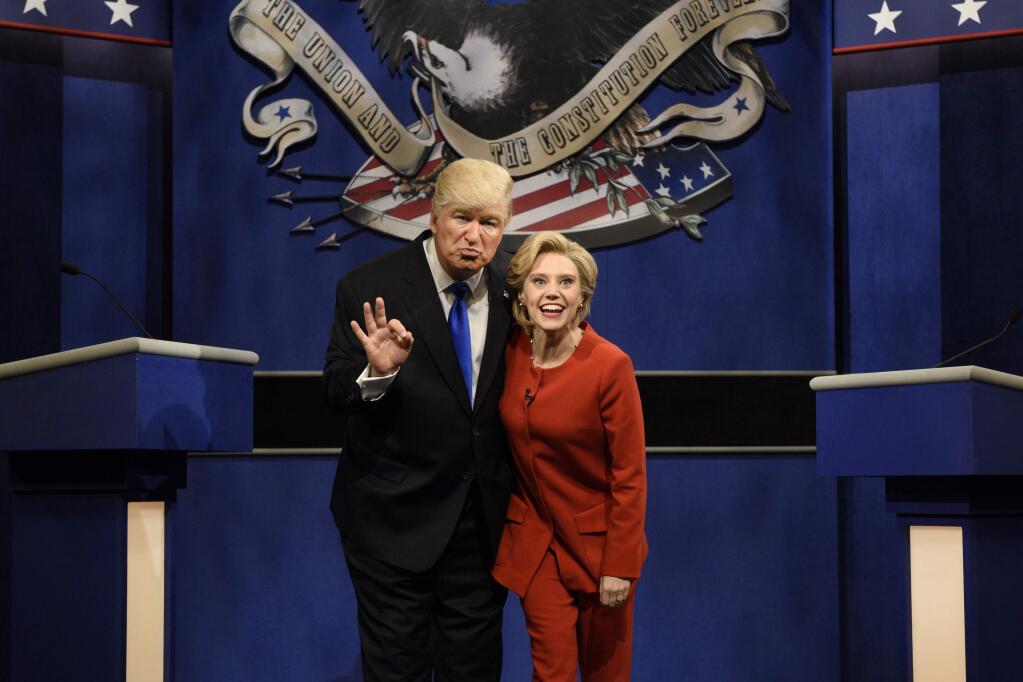 FILE - In a Saturday, Oct. 1, 2016 file photo provided by NBC, Alec Baldwin, left, as Republican presidential candidate, Donald Trump, and Kate McKinnon, as Democratic presidential candidate, Hillary Clinton, perform on the 42nd season of 'Saturday Night Live,' in New York. Republican presidential candidate Donald Trump tweeted early Sunday morning, Oct. 16, 2016, that the show‚Äôs skit depicting him this week was a ‚Äúhit job.‚Äù Trump went on to write that it‚Äôs ‚Äútime to retire‚Äù the show, calling it ‚Äúboring and unfunny‚Äù and adding that Alec Baldwin‚Äôs portrayal of him ‚Äústinks.‚Äù (Will Heath/NBC via AP, File)
