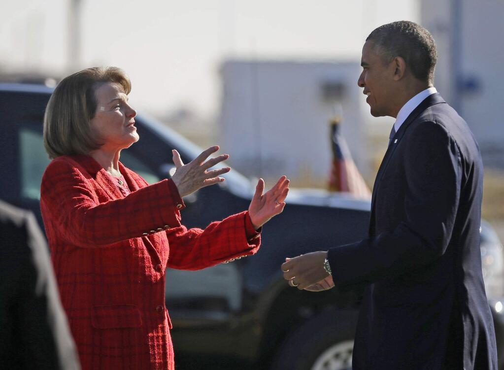 FILE - In this Nov. 25, 2013 file photo, President Barack Obama and Sen. Dianne Feinstein, D-Calif., greet each other on the tarmac upon his arrival on Air Force One at San Francisco International Airport. Obama is backing Feinstein for re-election as she faces a challenge from within the Democratic party. The California senator released a statement from Obama Friday, May 4, 2018, calling Feinstein one of the 'most effective champions for progress.' She's facing a challenge from state Sen. Kevin de Leon. (AP Photo/Pablo Martinez Monsivais, File)