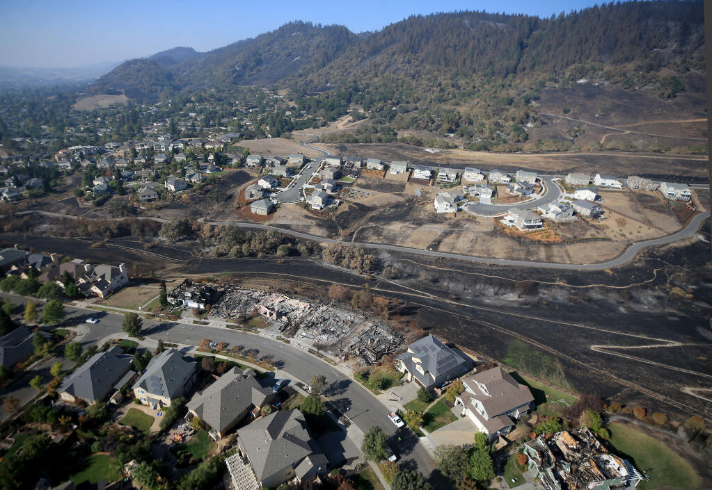 Firefighters made a stand on Night Hawk Drive, bottom,  losing a number of homes, but also saving hundreds to the west as embers landed in vegetation surrounding the houses. At top, Sunhawk Drive was also heavily defended as the Glass charted a path of destruction to the west and north. (Kent Porter / The Press Democrat) 2020