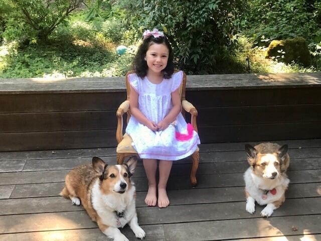 Maggie Couch with her maternal grandparents’ regal Welsh corgis, Maggie and Lucy.