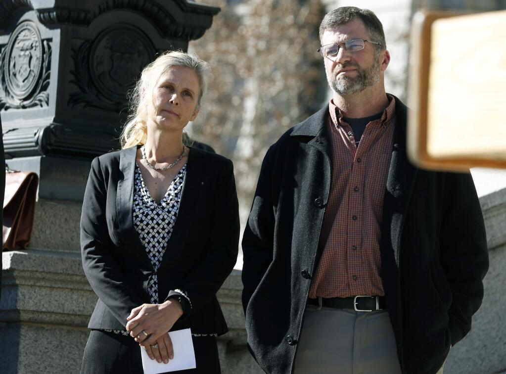 FILE - In this Feb. 19, 2015 file photo Hope, left, and Mike Reilly of Pueblo, Colo., attend a news conference in reaction to the announcement that a federal lawsuit is being filed on behalf of the couple by a Washington D.C.-based group to shut down the state's $800-million-a-year marijuana industry, in Denver. A federal jury in Denver has ruled against the couple, finding that a neighboring marijuana grow operator did not hurt their property values. It was the first time a jury considered a lawsuit using federal anti-racketeering law to target a marijuana company. (AP Photo/David Zalubowski, File)