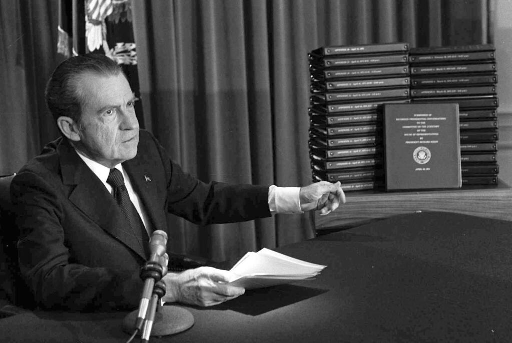 Associated PressPresident Richard M. Nixon points to the transcripts of the White House tapes after he announced during a nationally-televised speech in 1974 that he would turn over the transcripts to House impeachment investigators.