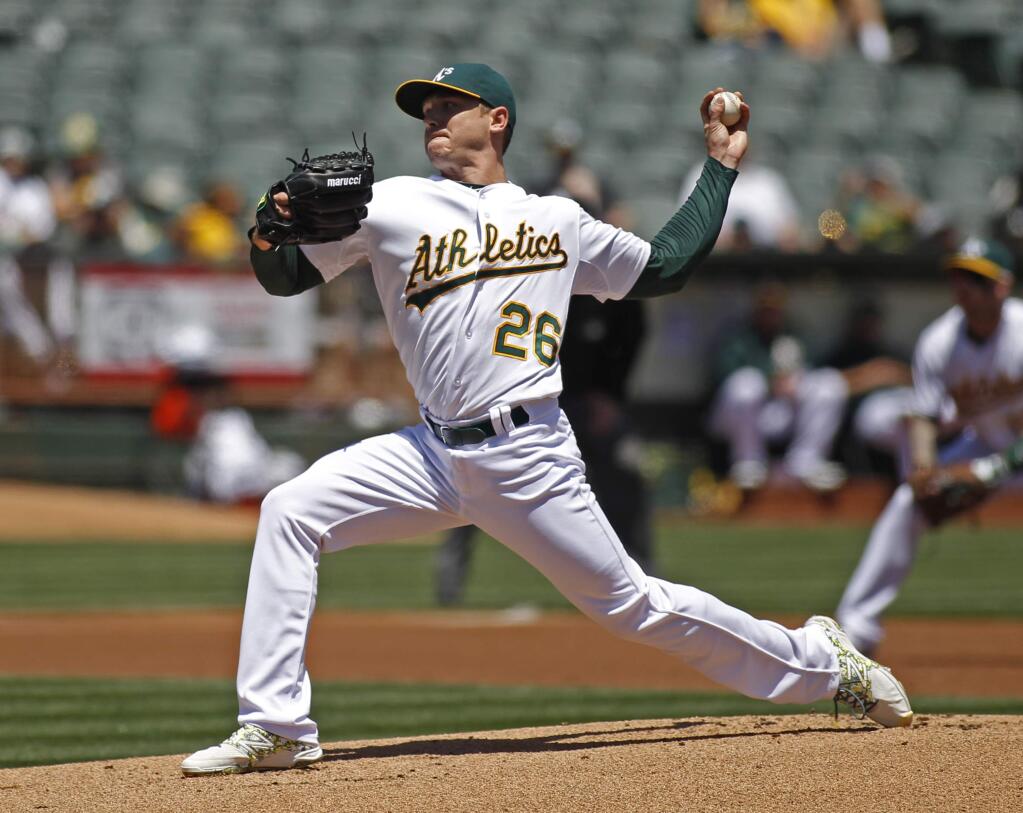 Oakland Athletics pitcher Scott Kazmir throws to the Detroit Tigers during the first inning of a baseball game, Wednesday, May 27, 2015, in Oakland. (AP Photo/George Nikitin)