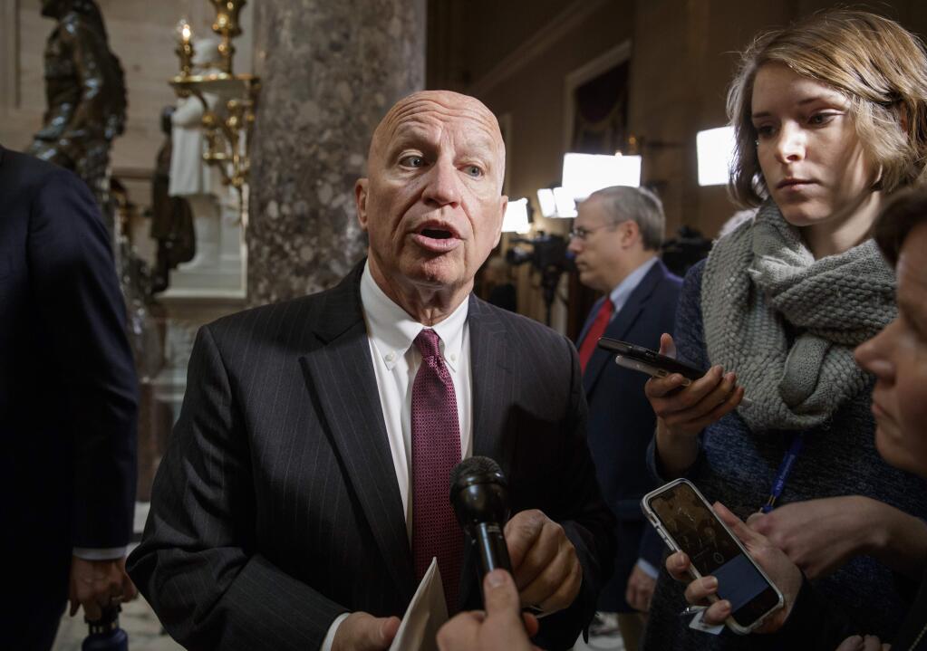 In this Oct. 26, 2017, photo, House Ways and Means Committee Chairman Kevin Brady, R-Texas, whose panel is charged with writing tax law, talks to reporters on Capitol Hill in Washington. (AP Photo/J. Scott Applewhite)