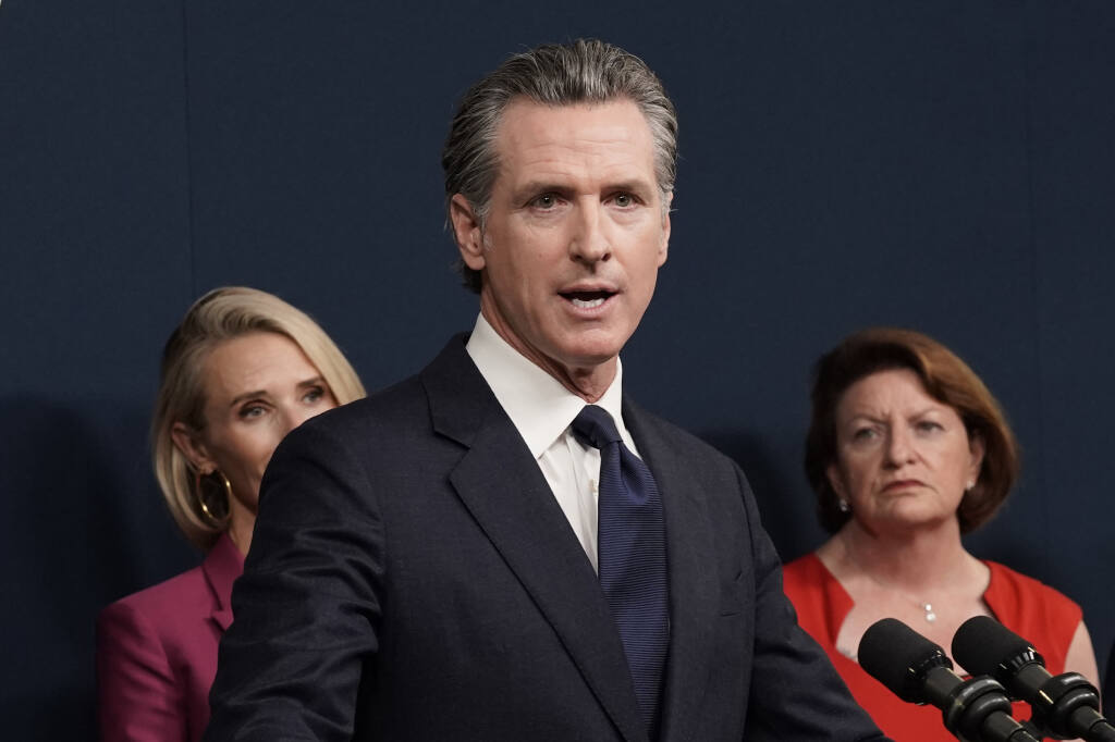 California Gov. Gavin Newsom discusses the Supreme Court's decision to overturn Roe v. Wade during a news conference in Sacramento, Calif., Friday, June 24, 2022. (AP Photo/Rich Pedroncelli)