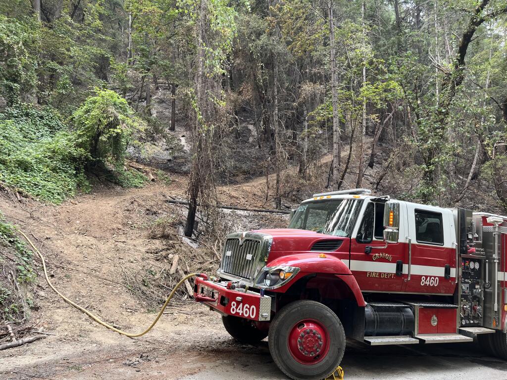 Graton Fire lays hose on the Six Rivers Lightning Fire. Photo provided.